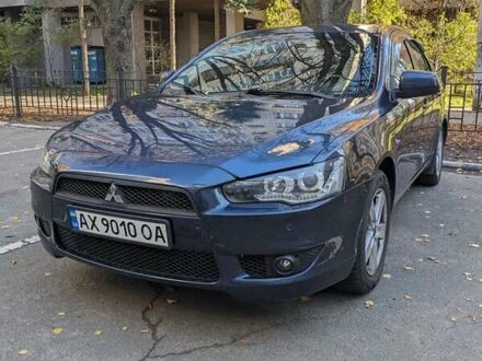 Синий Мицубиси Лансер, объемом двигателя 2 л и пробегом 300 тыс. км за 6250 $, фото 1 на Automoto.ua