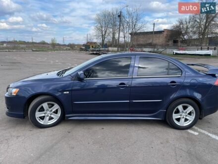 Синій Міцубісі Lancer, об'ємом двигуна 2 л та пробігом 265 тис. км за 7000 $, фото 1 на Automoto.ua