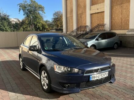 Синий Мицубиси Лансер, объемом двигателя 2 л и пробегом 3 тыс. км за 4200 $, фото 1 на Automoto.ua