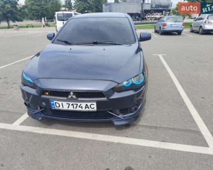 Синій Міцубісі Lancer, об'ємом двигуна 2 л та пробігом 213 тис. км за 7300 $, фото 1 на Automoto.ua