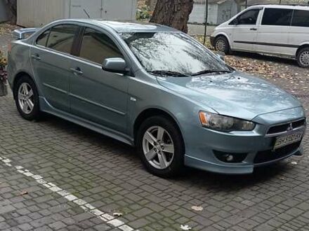 Синий Мицубиси Лансер, объемом двигателя 2 л и пробегом 300 тыс. км за 6900 $, фото 1 на Automoto.ua