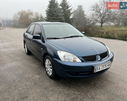 Синий Мицубиси Лансер, объемом двигателя 1.59 л и пробегом 126 тыс. км за 5950 $, фото 1 на Automoto.ua