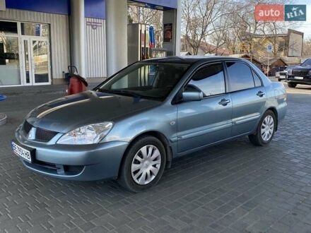 Синій Міцубісі Lancer, об'ємом двигуна 1.58 л та пробігом 166 тис. км за 5500 $, фото 1 на Automoto.ua