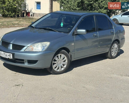 Синий Мицубиси Лансер, объемом двигателя 1.58 л и пробегом 243 тыс. км за 4400 $, фото 1 на Automoto.ua
