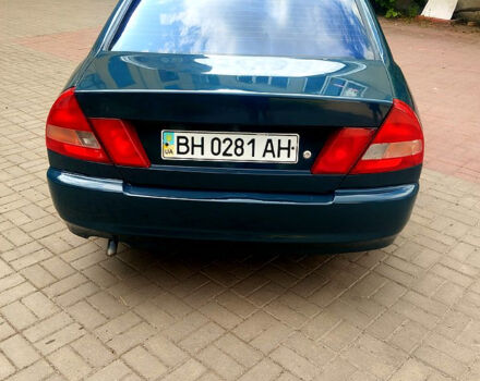 Зеленый Мицубиси Лансер, объемом двигателя 1.3 л и пробегом 300 тыс. км за 1550 $, фото 3 на Automoto.ua