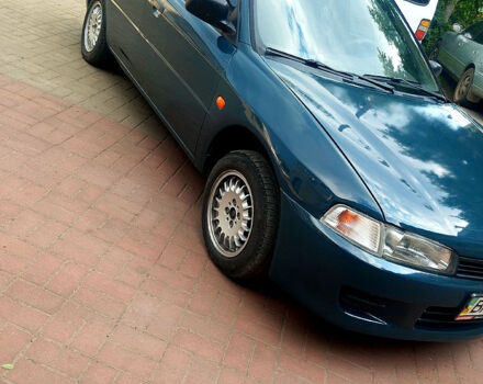 Зеленый Мицубиси Лансер, объемом двигателя 1.3 л и пробегом 300 тыс. км за 1550 $, фото 1 на Automoto.ua