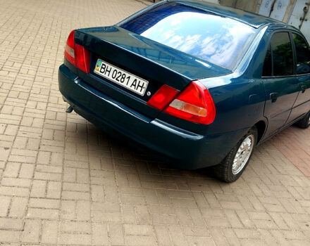 Зеленый Мицубиси Лансер, объемом двигателя 1.3 л и пробегом 300 тыс. км за 1550 $, фото 2 на Automoto.ua