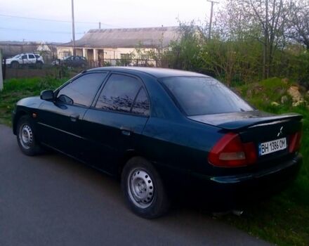 Зелений Міцубісі Lancer, об'ємом двигуна 1.3 л та пробігом 300 тис. км за 1950 $, фото 2 на Automoto.ua