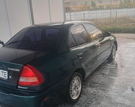 Зеленый Мицубиси Лансер, объемом двигателя 1.3 л и пробегом 400 тыс. км за 2300 $, фото 3 на Automoto.ua