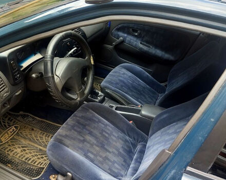 Зеленый Мицубиси Лансер, объемом двигателя 1.3 л и пробегом 300 тыс. км за 1550 $, фото 5 на Automoto.ua