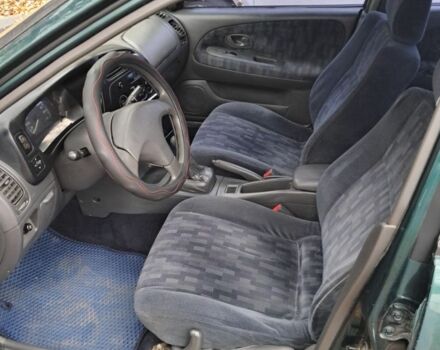 Зеленый Мицубиси Лансер, объемом двигателя 1.3 л и пробегом 400 тыс. км за 2300 $, фото 5 на Automoto.ua