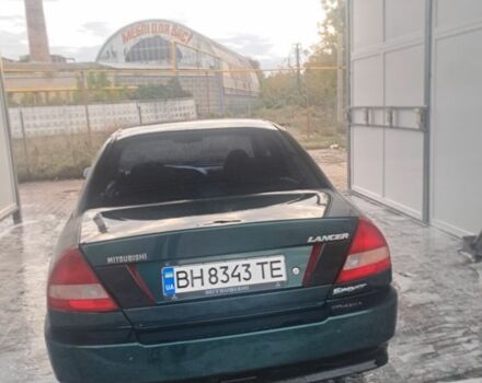 Зеленый Мицубиси Лансер, объемом двигателя 1.3 л и пробегом 400 тыс. км за 2300 $, фото 2 на Automoto.ua