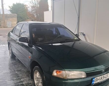 Зеленый Мицубиси Лансер, объемом двигателя 1.3 л и пробегом 400 тыс. км за 2300 $, фото 1 на Automoto.ua