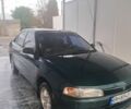 Зеленый Мицубиси Лансер, объемом двигателя 1.3 л и пробегом 400 тыс. км за 2300 $, фото 1 на Automoto.ua