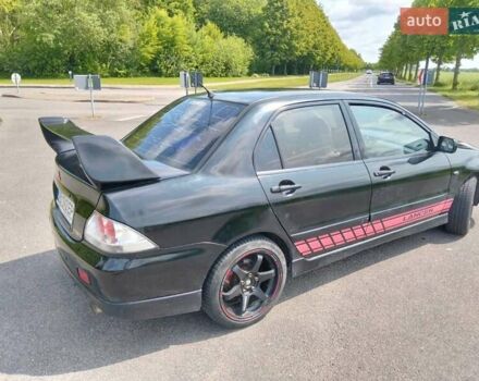 Зеленый Мицубиси Лансер, объемом двигателя 2 л и пробегом 340 тыс. км за 3500 $, фото 7 на Automoto.ua