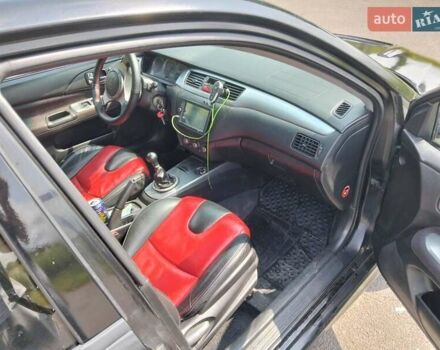 Зеленый Мицубиси Лансер, объемом двигателя 2 л и пробегом 340 тыс. км за 3500 $, фото 9 на Automoto.ua