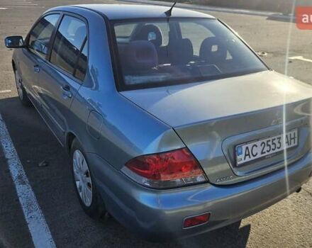 Зелений Міцубісі Lancer, об'ємом двигуна 1.58 л та пробігом 215 тис. км за 5000 $, фото 6 на Automoto.ua