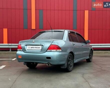 Зелений Міцубісі Lancer, об'ємом двигуна 1.58 л та пробігом 208 тис. км за 3990 $, фото 7 на Automoto.ua