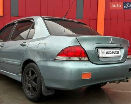 Зелений Міцубісі Lancer, об'ємом двигуна 1.58 л та пробігом 208 тис. км за 3990 $, фото 5 на Automoto.ua