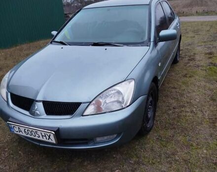 Зеленый Мицубиси Лансер, объемом двигателя 1.58 л и пробегом 224 тыс. км за 3500 $, фото 3 на Automoto.ua