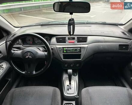 Зелений Міцубісі Lancer, об'ємом двигуна 1.58 л та пробігом 208 тис. км за 3990 $, фото 12 на Automoto.ua