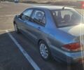 Зелений Міцубісі Lancer, об'ємом двигуна 1.58 л та пробігом 215 тис. км за 5000 $, фото 4 на Automoto.ua