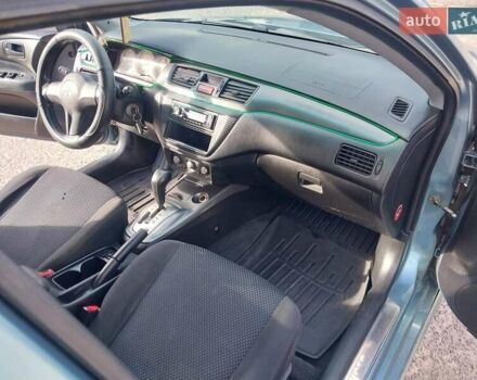 Зелений Міцубісі Lancer, об'ємом двигуна 1.58 л та пробігом 272 тис. км за 3800 $, фото 19 на Automoto.ua