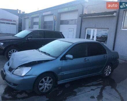 Зеленый Мицубиси Лансер, объемом двигателя 1.6 л и пробегом 184 тыс. км за 2000 $, фото 2 на Automoto.ua