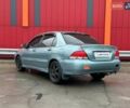 Зелений Міцубісі Lancer, об'ємом двигуна 1.58 л та пробігом 208 тис. км за 3990 $, фото 4 на Automoto.ua