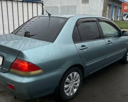 Зелений Міцубісі Lancer, об'ємом двигуна 1.6 л та пробігом 262 тис. км за 3999 $, фото 6 на Automoto.ua