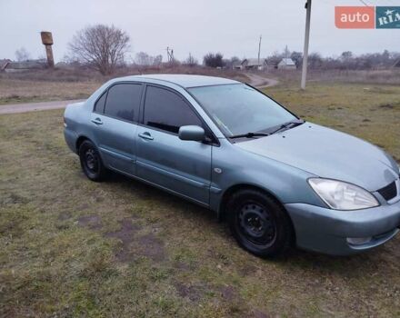 Зеленый Мицубиси Лансер, объемом двигателя 1.58 л и пробегом 224 тыс. км за 3500 $, фото 6 на Automoto.ua