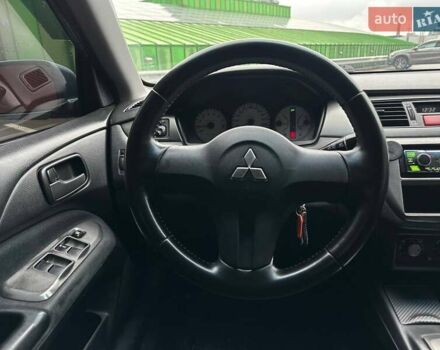 Зелений Міцубісі Lancer, об'ємом двигуна 1.58 л та пробігом 208 тис. км за 3990 $, фото 14 на Automoto.ua