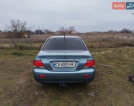 Зеленый Мицубиси Лансер, объемом двигателя 1.58 л и пробегом 224 тыс. км за 3500 $, фото 1 на Automoto.ua