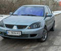 Зелений Міцубісі Lancer, об'ємом двигуна 1.6 л та пробігом 320 тис. км за 4500 $, фото 1 на Automoto.ua