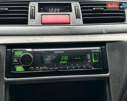 Зелений Міцубісі Lancer, об'ємом двигуна 1.58 л та пробігом 208 тис. км за 3990 $, фото 19 на Automoto.ua