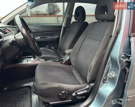 Зелений Міцубісі Lancer, об'ємом двигуна 1.58 л та пробігом 208 тис. км за 3990 $, фото 8 на Automoto.ua