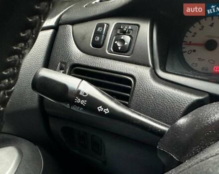 Зелений Міцубісі Lancer, об'ємом двигуна 1.58 л та пробігом 208 тис. км за 3990 $, фото 21 на Automoto.ua