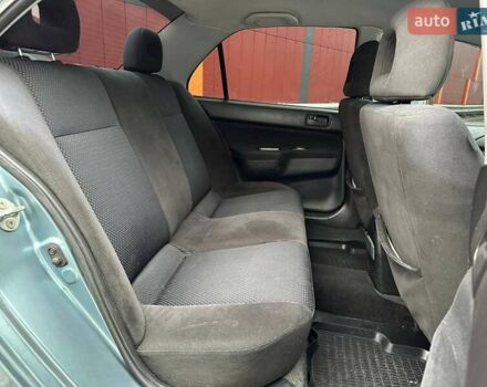 Зелений Міцубісі Lancer, об'ємом двигуна 1.58 л та пробігом 208 тис. км за 3990 $, фото 10 на Automoto.ua