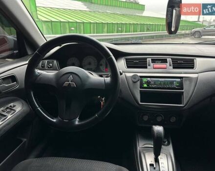 Зелений Міцубісі Lancer, об'ємом двигуна 1.58 л та пробігом 208 тис. км за 3990 $, фото 13 на Automoto.ua