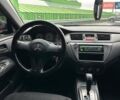 Зелений Міцубісі Lancer, об'ємом двигуна 1.58 л та пробігом 208 тис. км за 3990 $, фото 13 на Automoto.ua