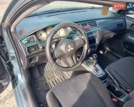 Зелений Міцубісі Lancer, об'ємом двигуна 1.58 л та пробігом 272 тис. км за 3800 $, фото 15 на Automoto.ua