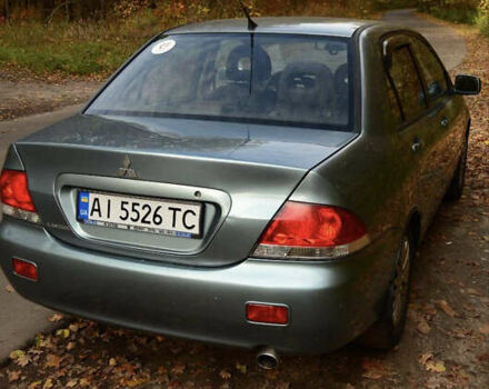 Зеленый Мицубиси Лансер, объемом двигателя 1.58 л и пробегом 259 тыс. км за 4300 $, фото 1 на Automoto.ua