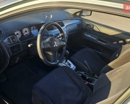 Зелений Міцубісі Lancer, об'ємом двигуна 1.58 л та пробігом 215 тис. км за 5000 $, фото 8 на Automoto.ua