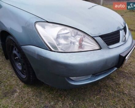 Зеленый Мицубиси Лансер, объемом двигателя 1.58 л и пробегом 224 тыс. км за 3500 $, фото 7 на Automoto.ua