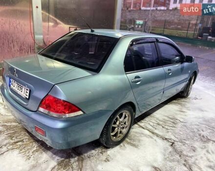 Зеленый Мицубиси Лансер, объемом двигателя 1.58 л и пробегом 352 тыс. км за 3700 $, фото 12 на Automoto.ua