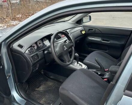 Зеленый Мицубиси Лансер, объемом двигателя 1.58 л и пробегом 207 тыс. км за 4200 $, фото 2 на Automoto.ua