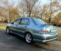 Зелений Міцубісі Lancer, об'ємом двигуна 2 л та пробігом 225 тис. км за 5600 $, фото 6 на Automoto.ua