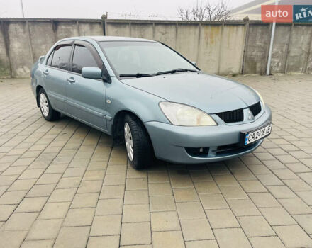 Зеленый Мицубиси Лансер, объемом двигателя 1.6 л и пробегом 164 тыс. км за 5000 $, фото 4 на Automoto.ua