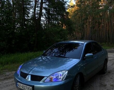 Зеленый Мицубиси Лансер, объемом двигателя 1.6 л и пробегом 238 тыс. км за 4000 $, фото 1 на Automoto.ua
