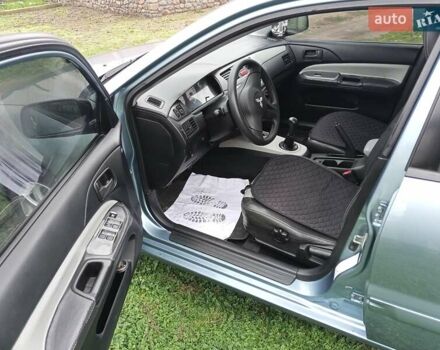 Зеленый Мицубиси Лансер, объемом двигателя 1.58 л и пробегом 300 тыс. км за 3999 $, фото 5 на Automoto.ua